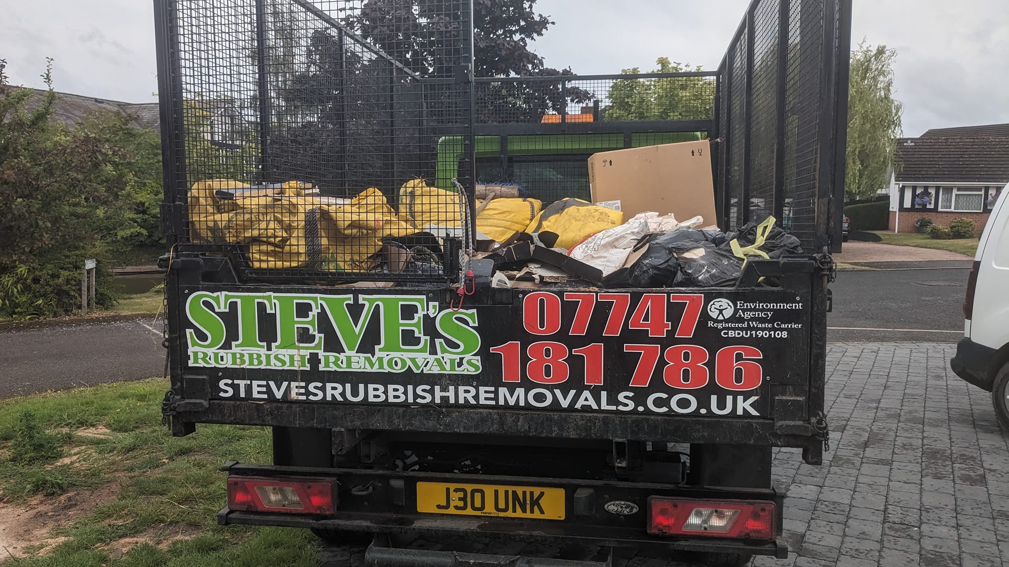 Steve's caged tipper loaded with waste